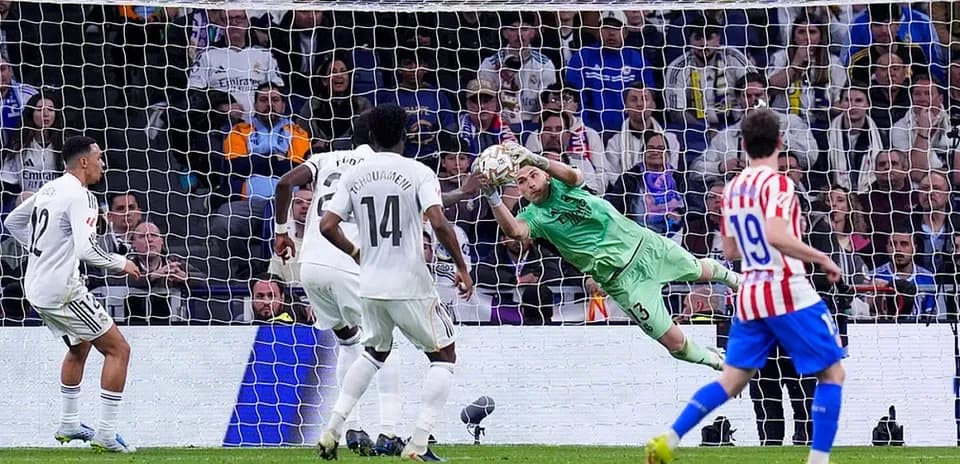 Goalkeeper saves penalty during Madrid derby
