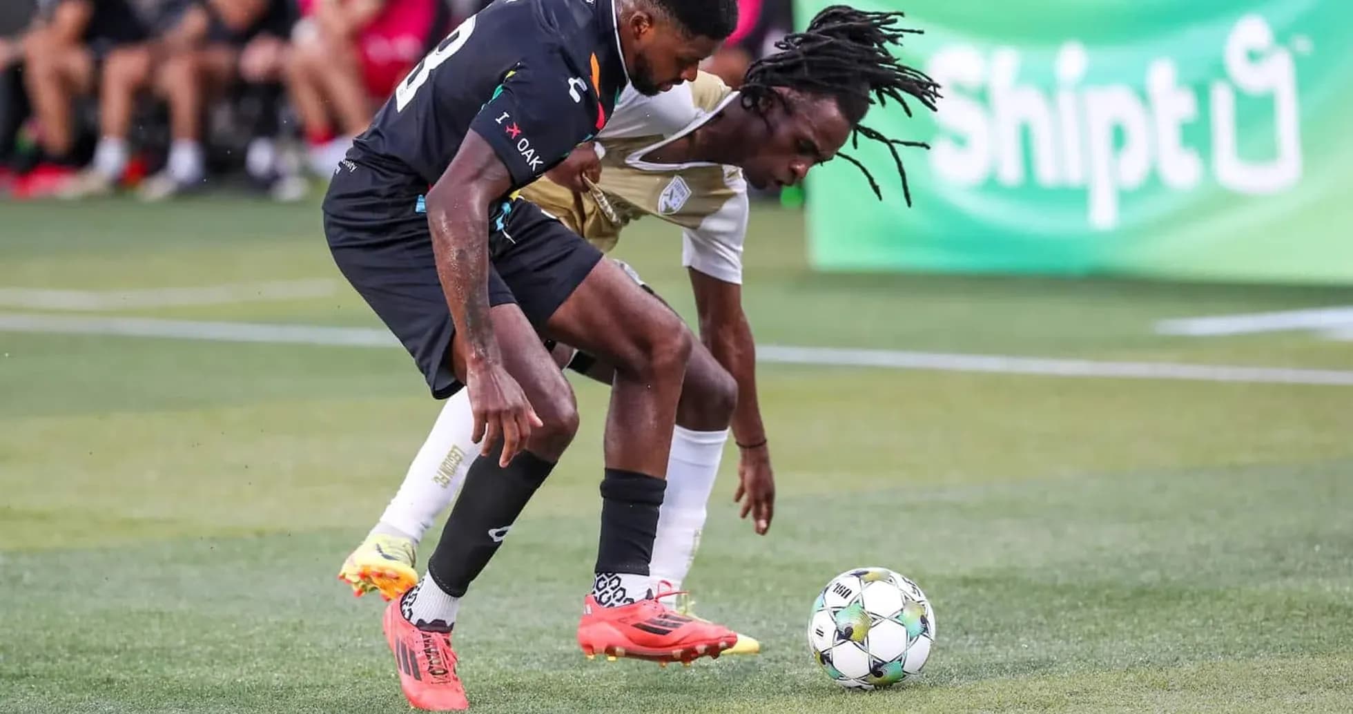 Players battling for the ball during match