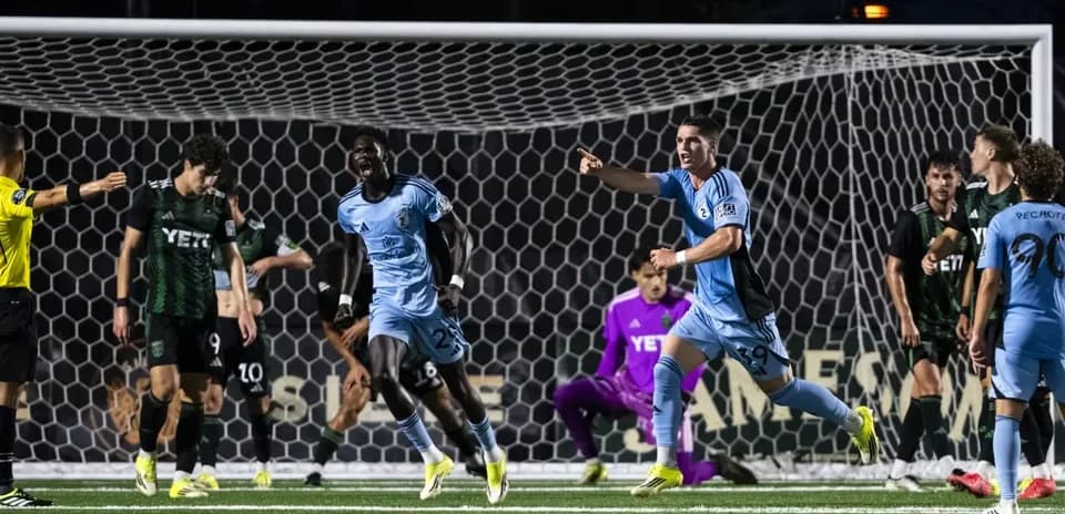 Players celebrating a goal during Houston Dynamo match