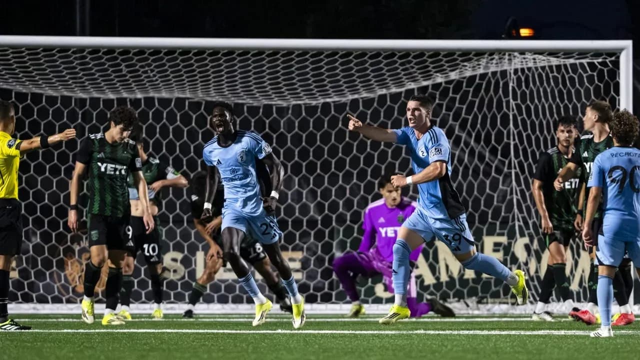 Players celebrating a goal during Houston Dynamo match