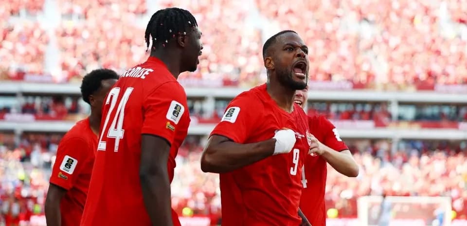 Canada players celebrating during World Cup match