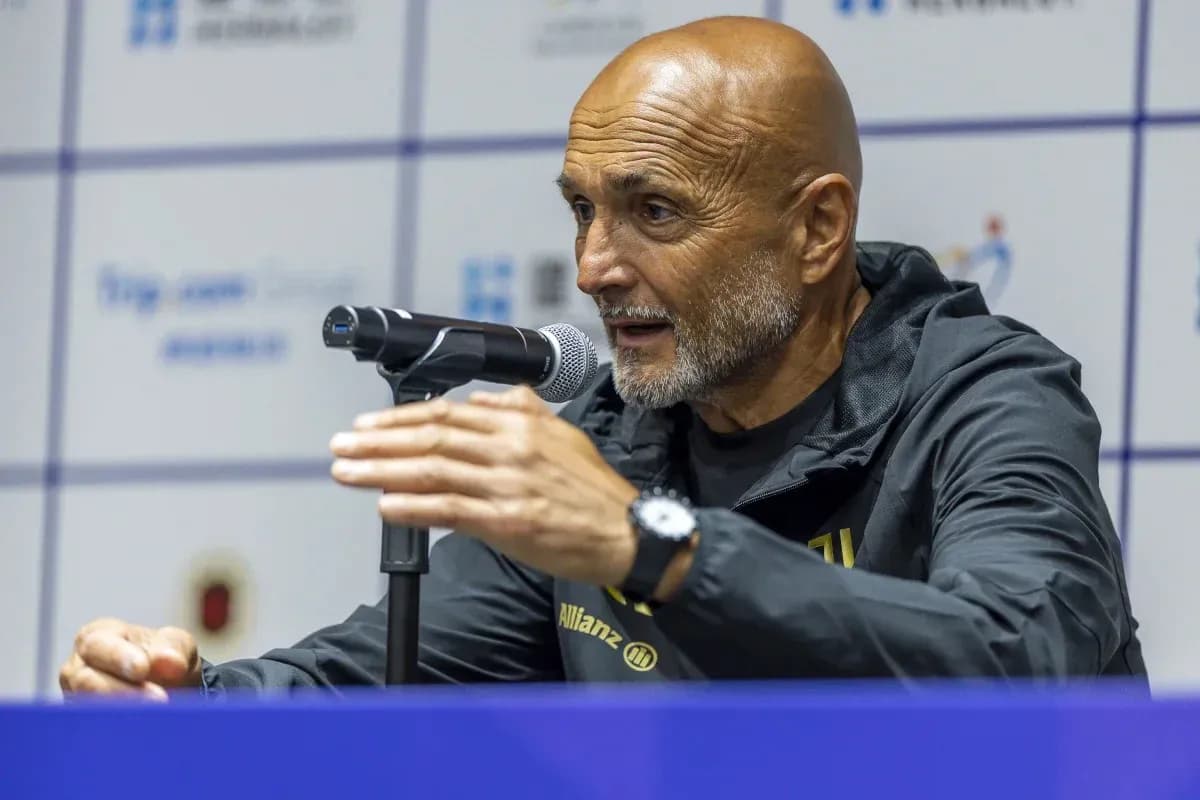 Coach speaking at press conference with microphone