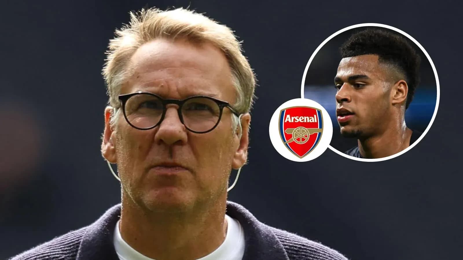 Coach with glasses and Arsenal logo in background