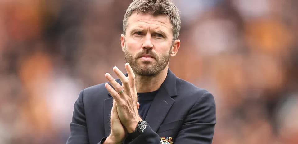 Coach clapping during a match on the sidelines