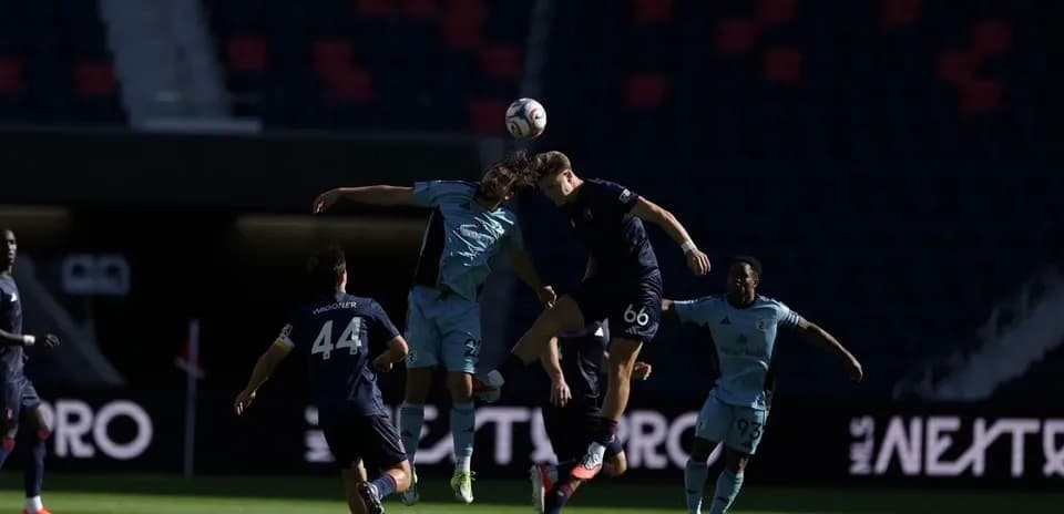 Players competing for the ball during match