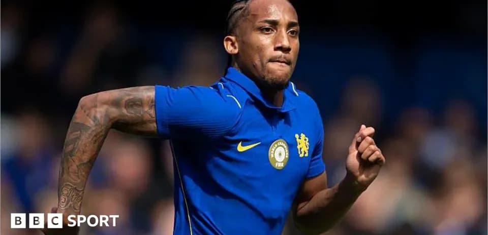 Player running on the field in blue jersey