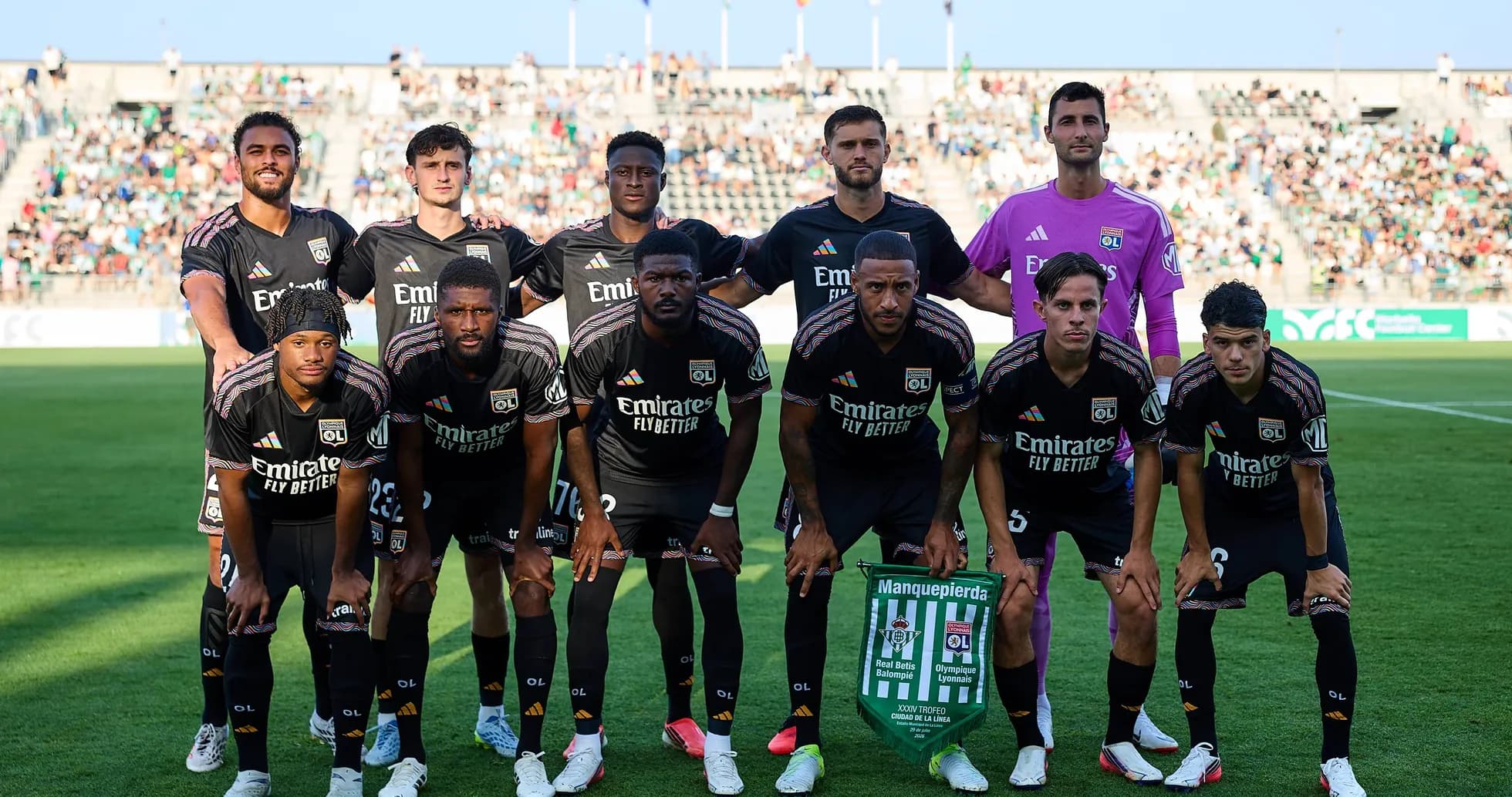 Lyon team posing before UEFA Champions League match