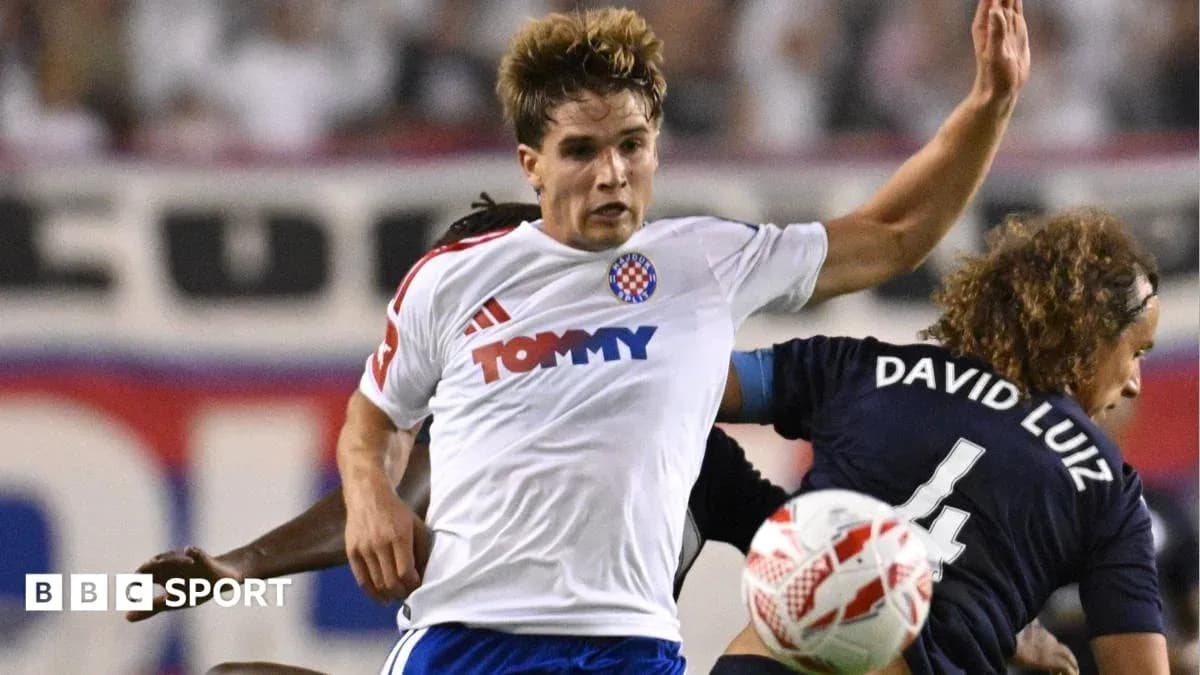 Player challenging opponent during intense football match