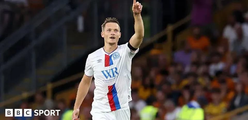 Player celebrating a goal with raised finger
