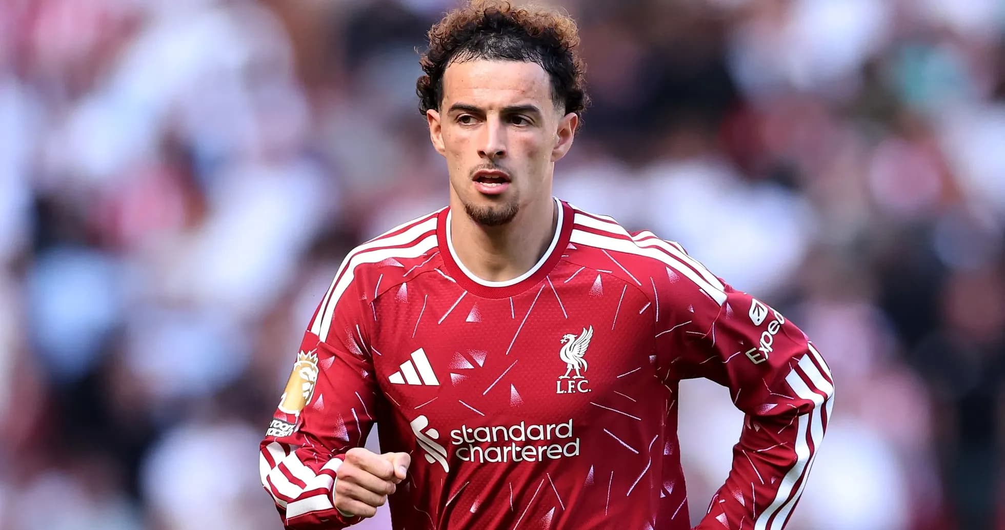 Liverpool player running on the pitch during match