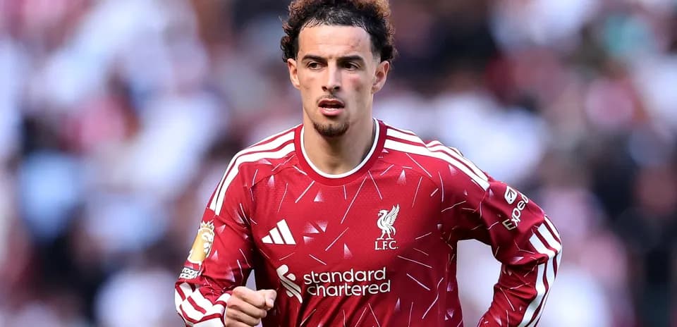 Liverpool player running on the pitch during match