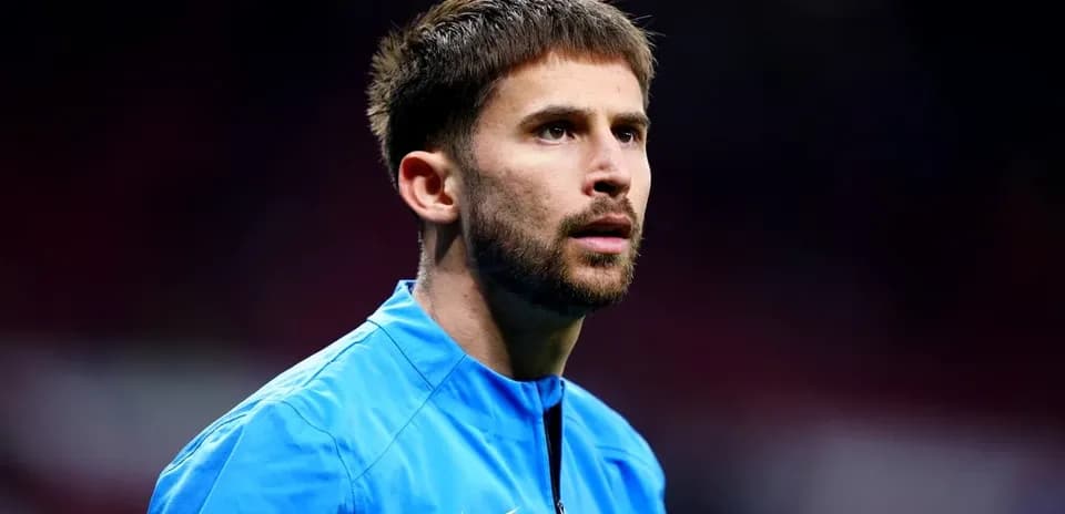 Player in blue kit preparing for match