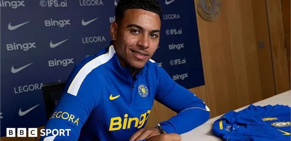 Player signing contract at club's announcement event