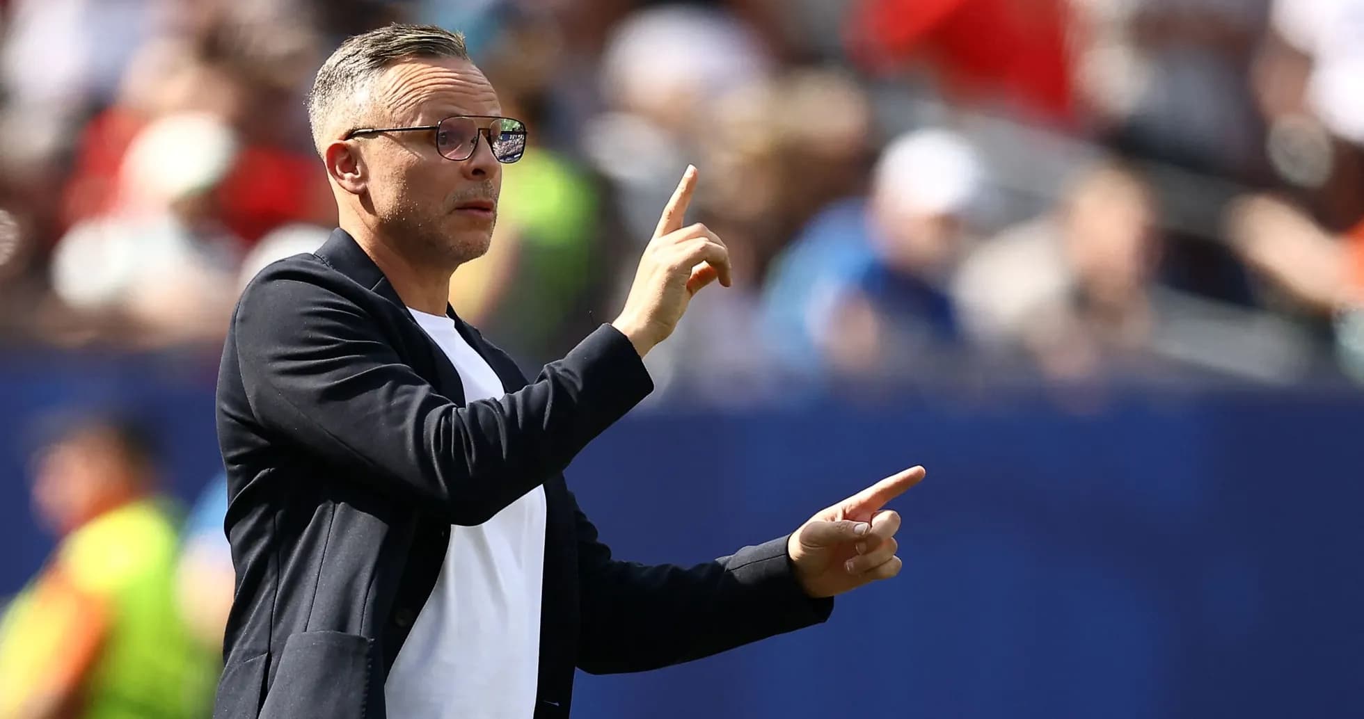 Coach gesturing during match from the sidelines