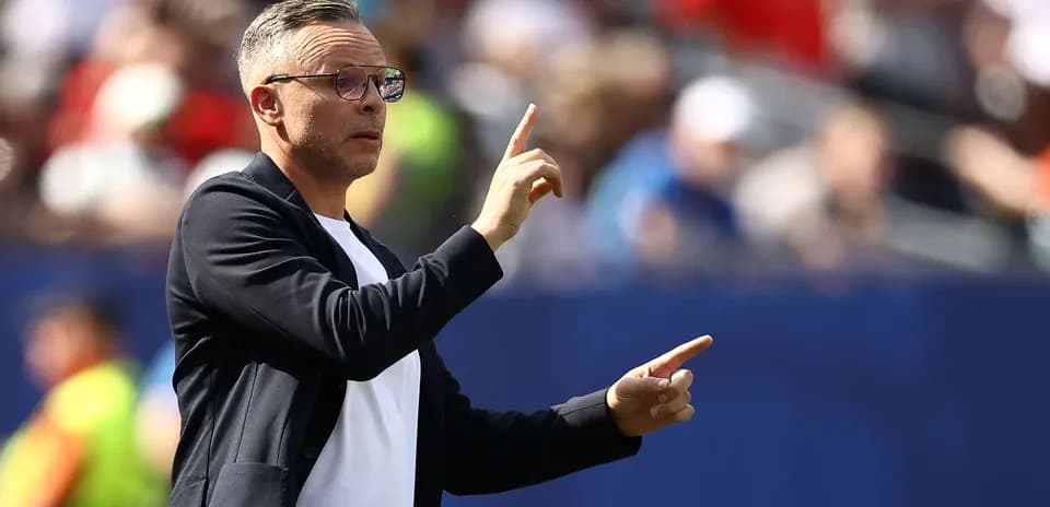 Coach gesturing during match from the sidelines