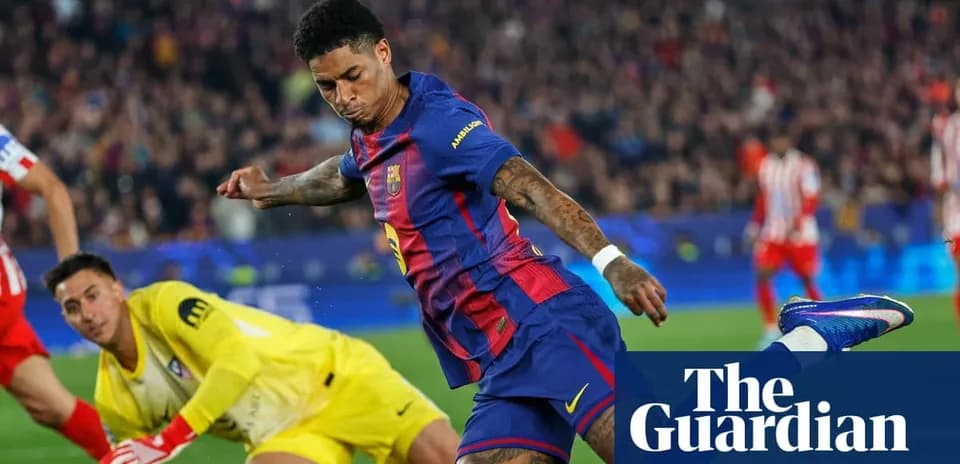 Barcelona player shooting while goalkeeper attempts save