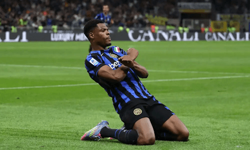 Player celebrating a goal on the pitch