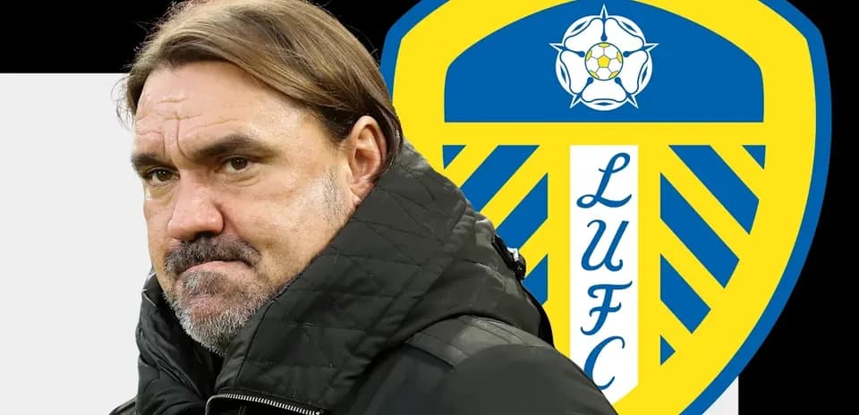 Coach in front of Leeds United logo
