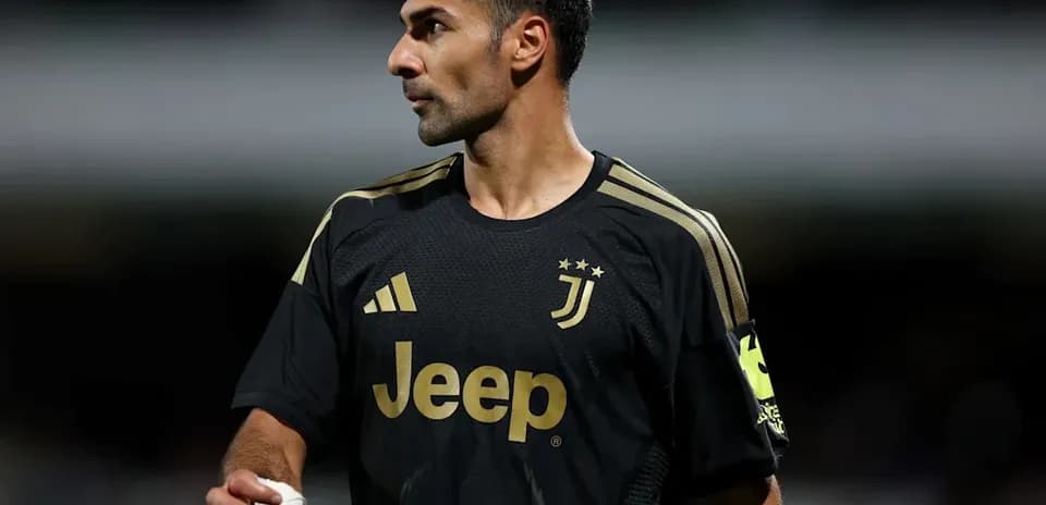 Goalkeeper in black Juventus kit during match