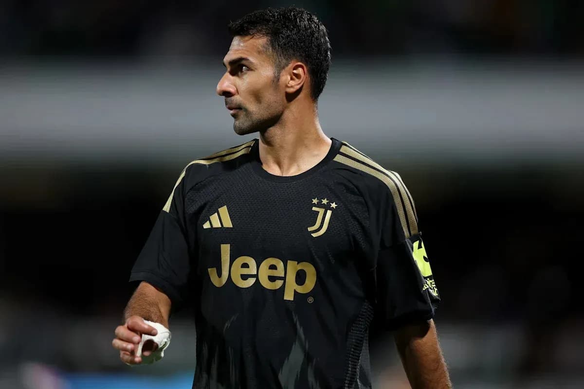 Goalkeeper in black Juventus kit during match