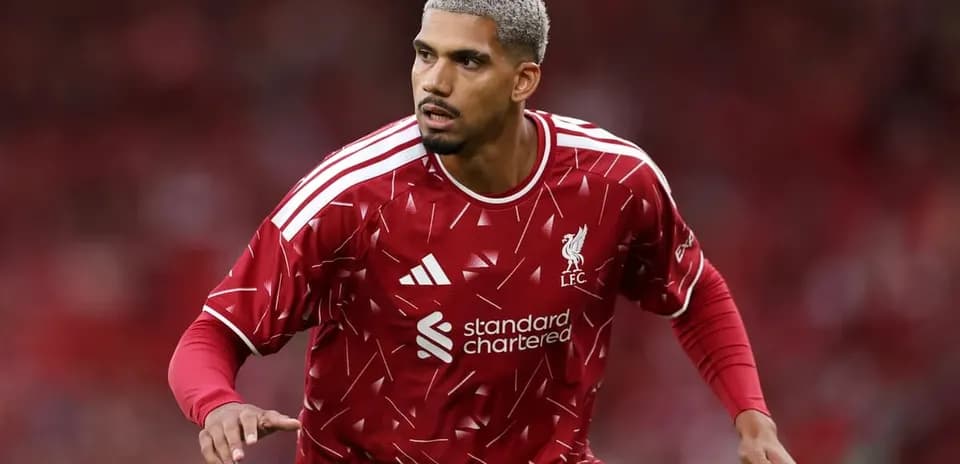 Player in red Liverpool kit during match preparation