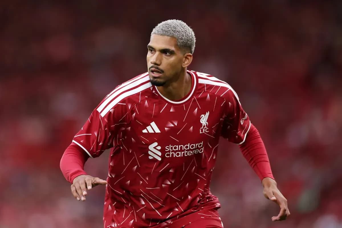 Player in red Liverpool kit during match preparation