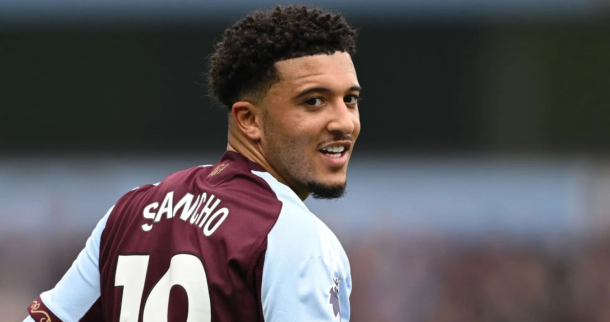 Player in Aston Villa jersey looking back