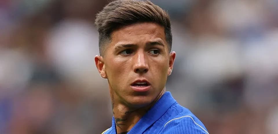 Player in blue jersey looking off-field during match