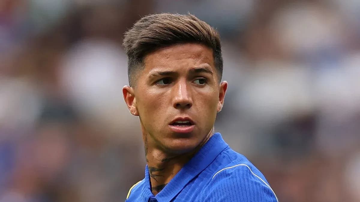 Player in blue jersey looking off-field during match