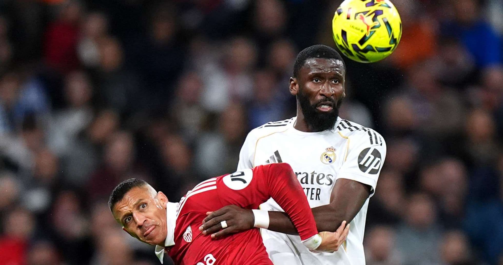 Players challenging for the ball during match