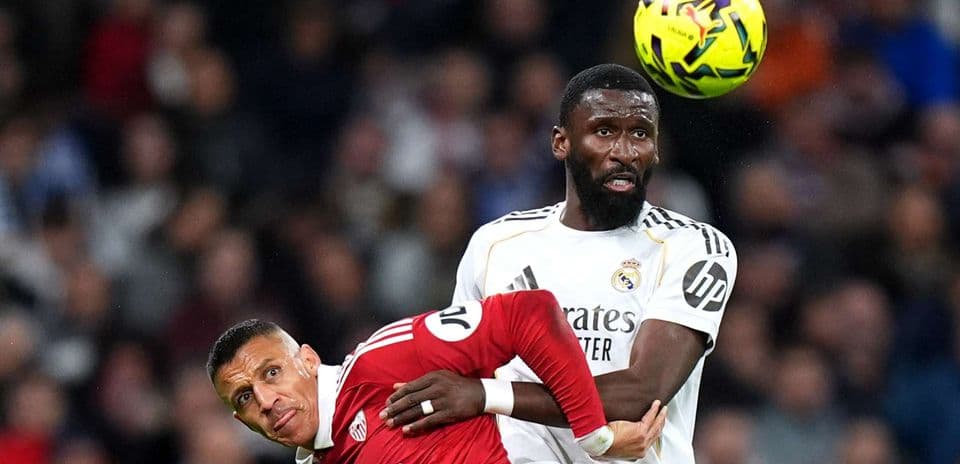 Players challenging for the ball during match
