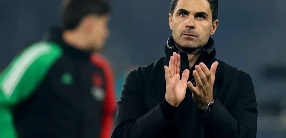 Coach clapping during training session on pitch