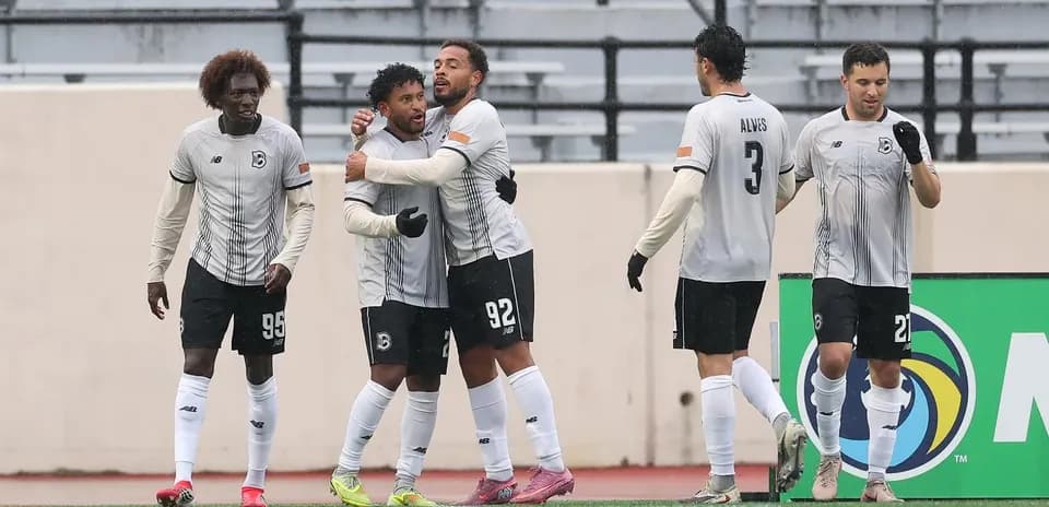 Brooklyn players celebrating a goal during match