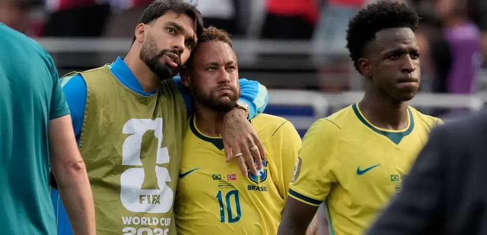 Brazilian players walking off the field after match