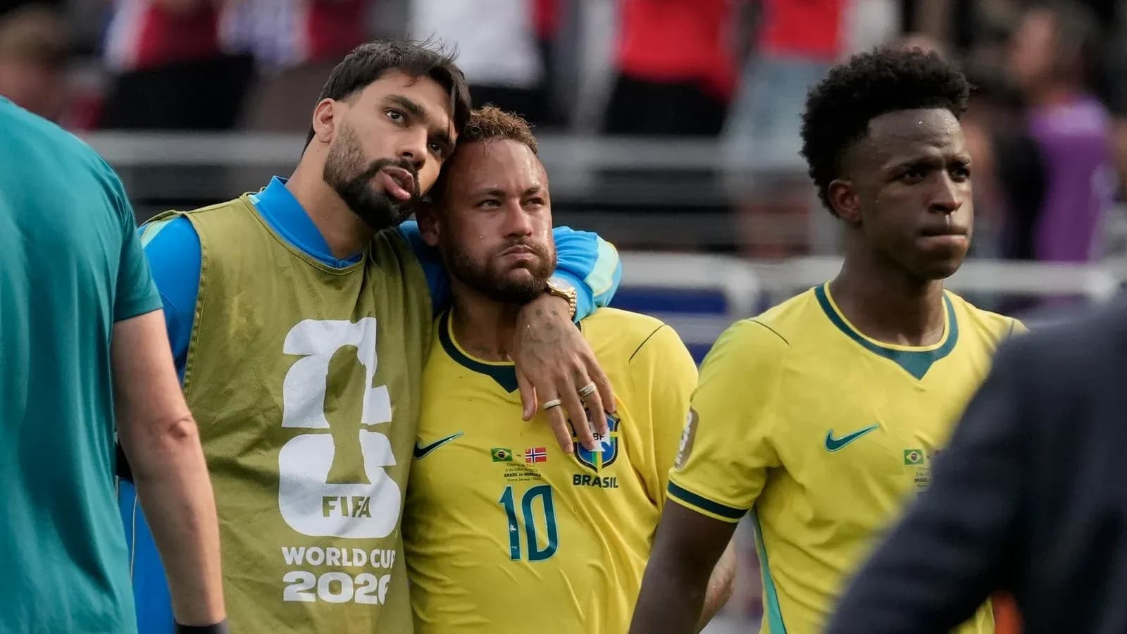 Brazilian players walking off the field after match