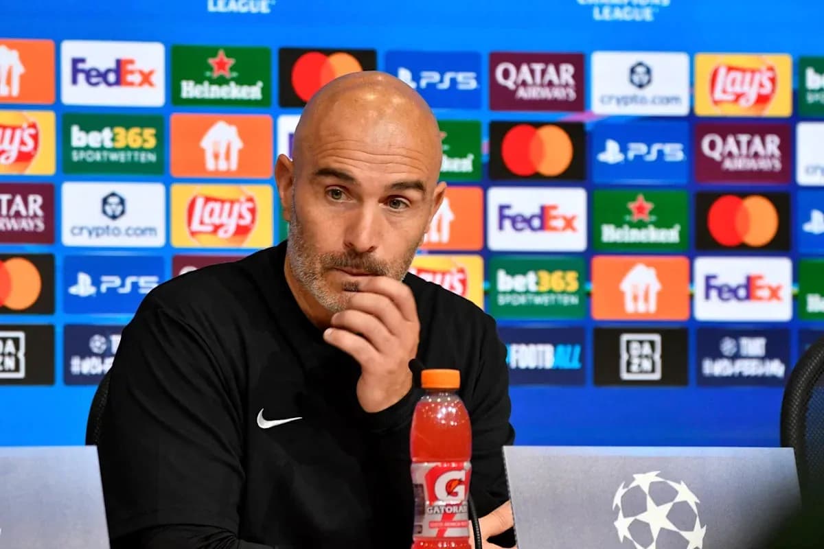 Coach speaking at UEFA Champions League press conference