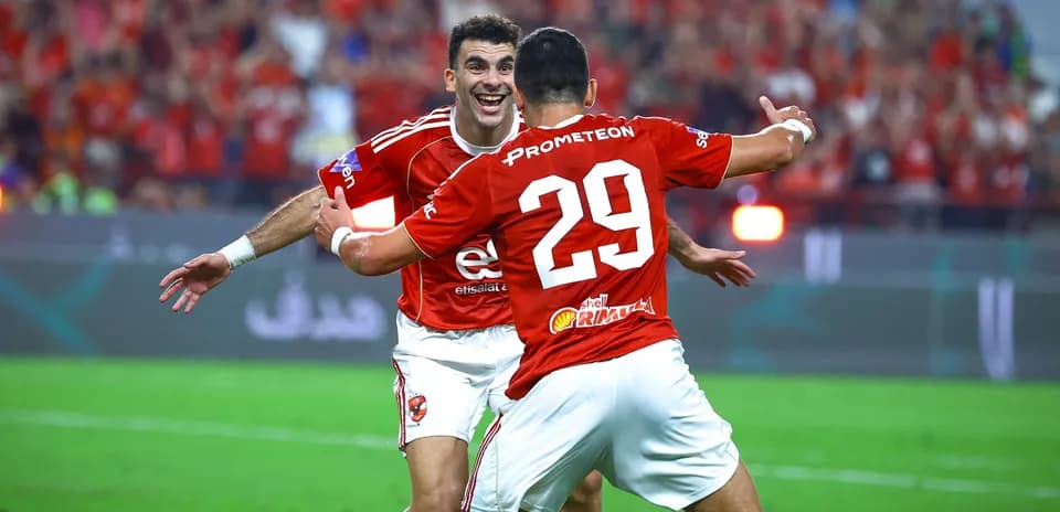 Players celebrating a goal during a match