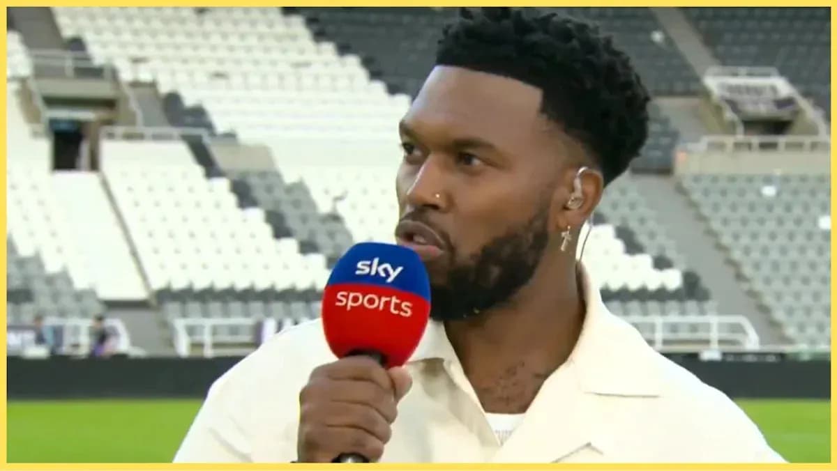 Presenter speaking into microphone at sports venue