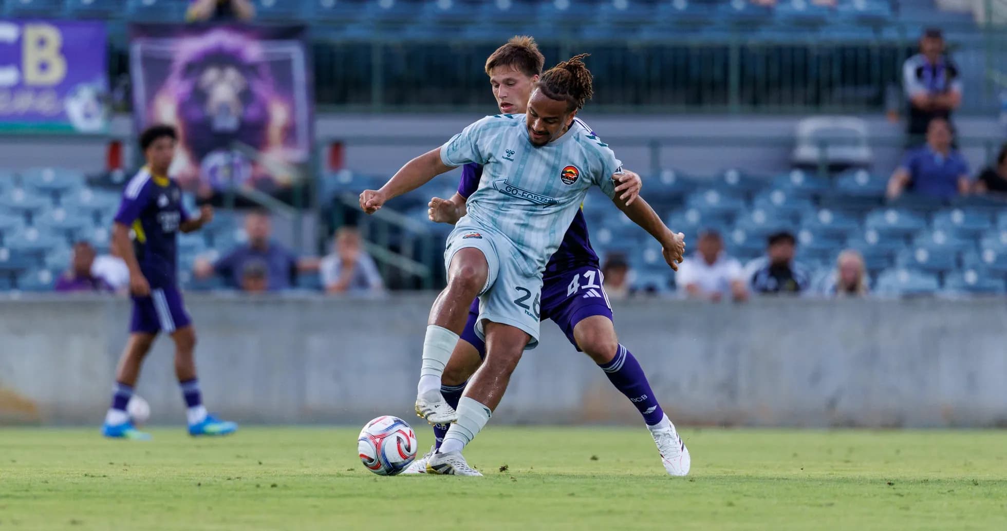 Players battling for the ball during match