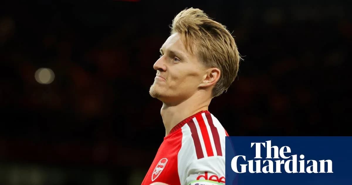 Arsenal player looking thoughtful during match