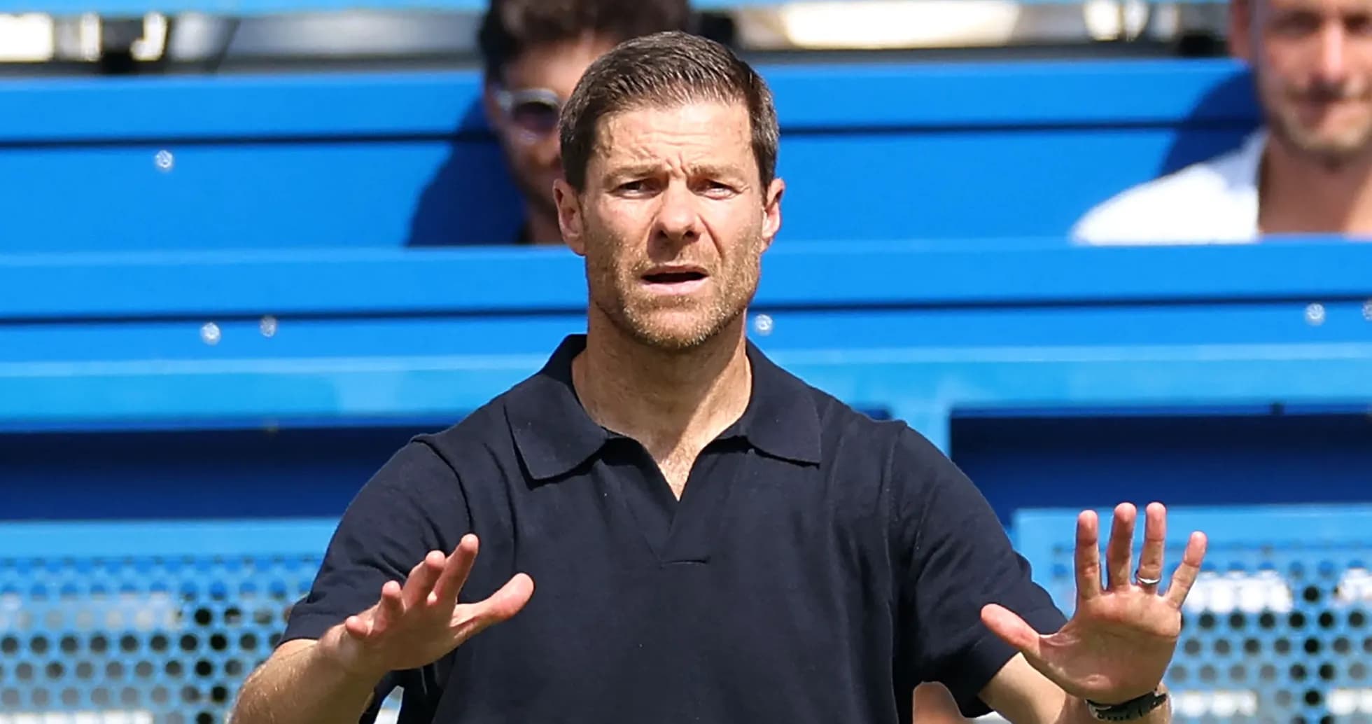 Coach gesturing from the sidelines during match