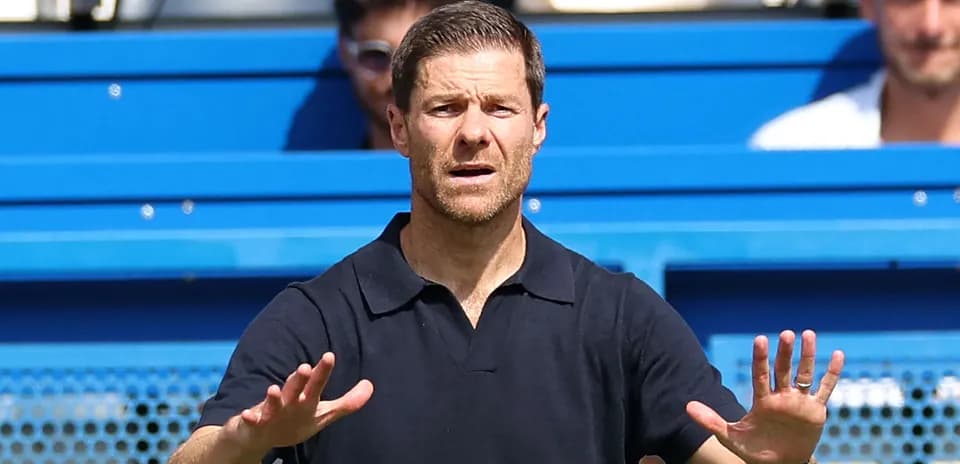 Coach gesturing from the sidelines during match