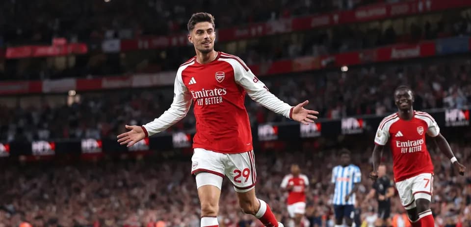 Arsenal player celebrating a goal at Emirates Stadium