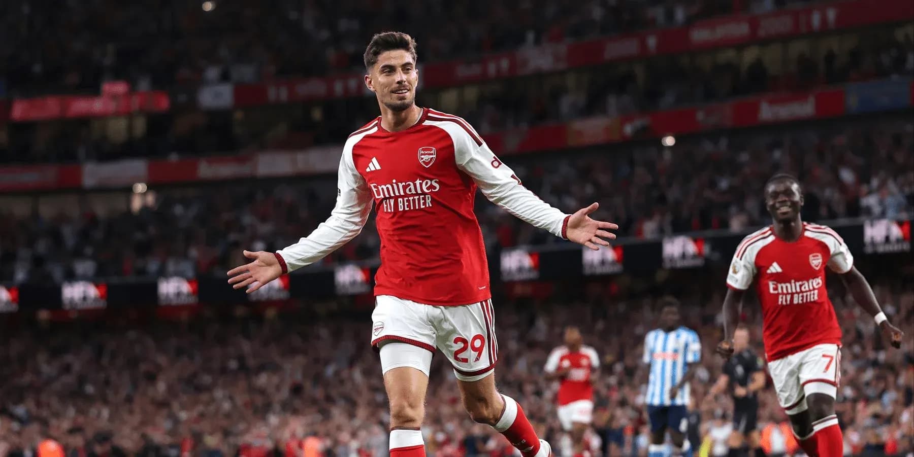 Arsenal player celebrating a goal at Emirates Stadium