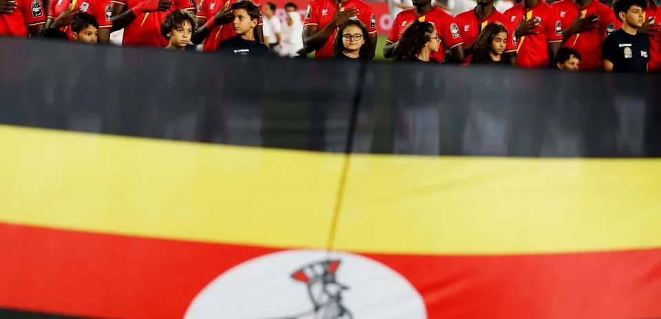 Players and children with Ugandan flag at event