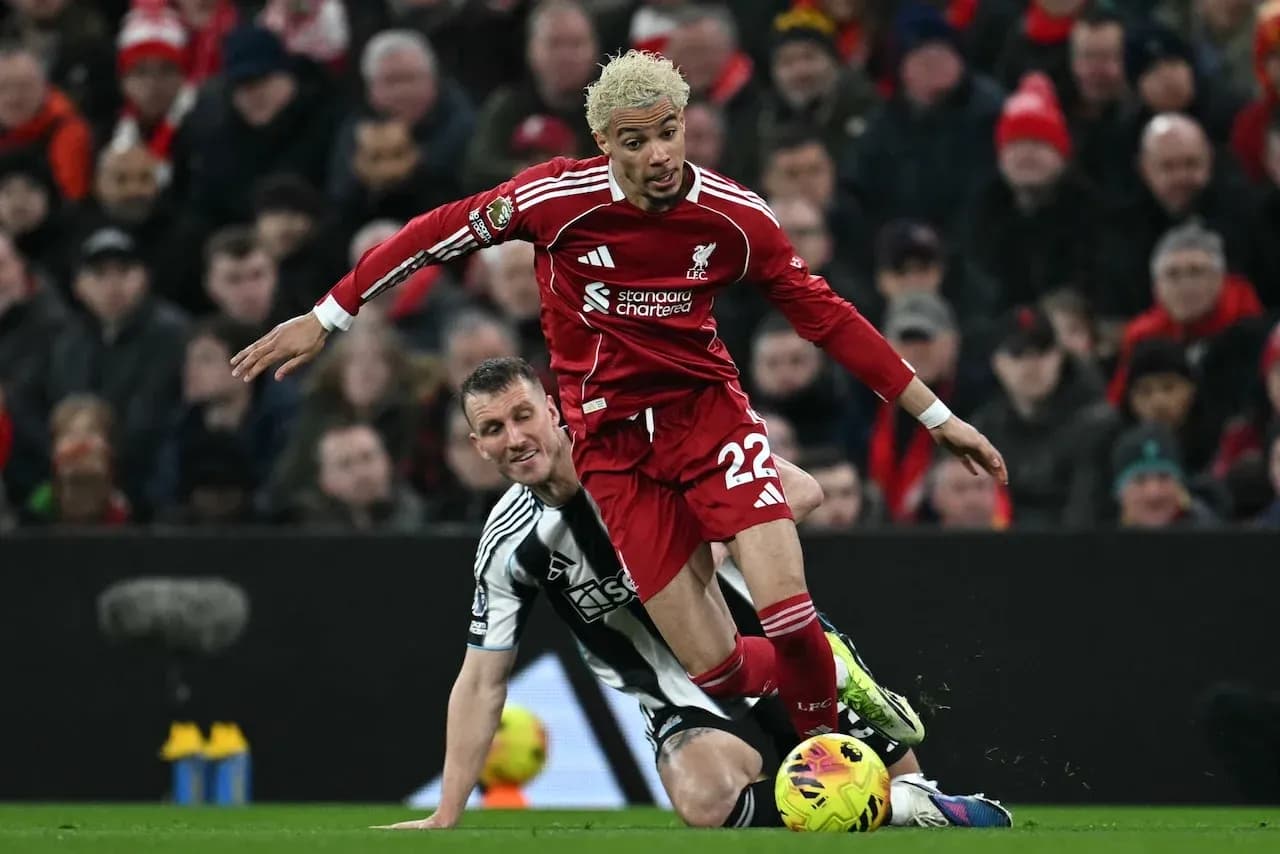Liverpool player challenged by Newcastle defender