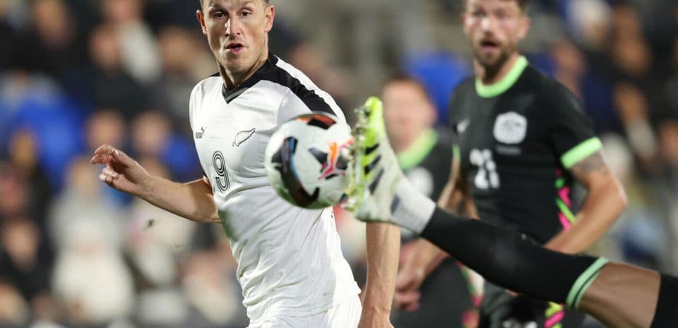 Player attempting to kick ball during match action