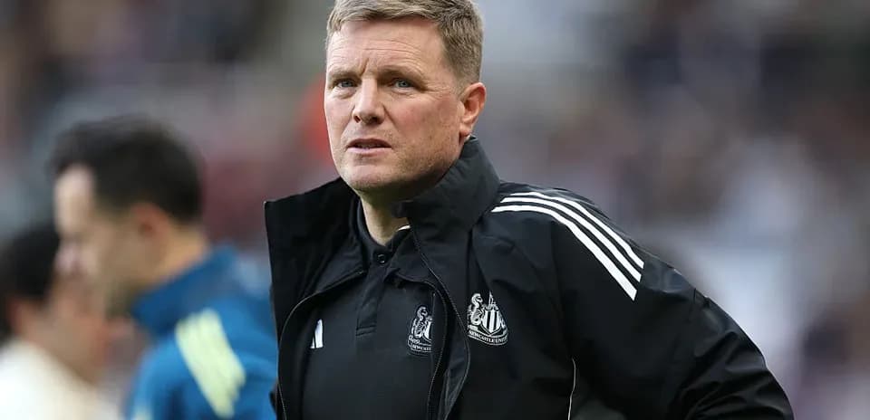 Newcastle manager observing match from sidelines