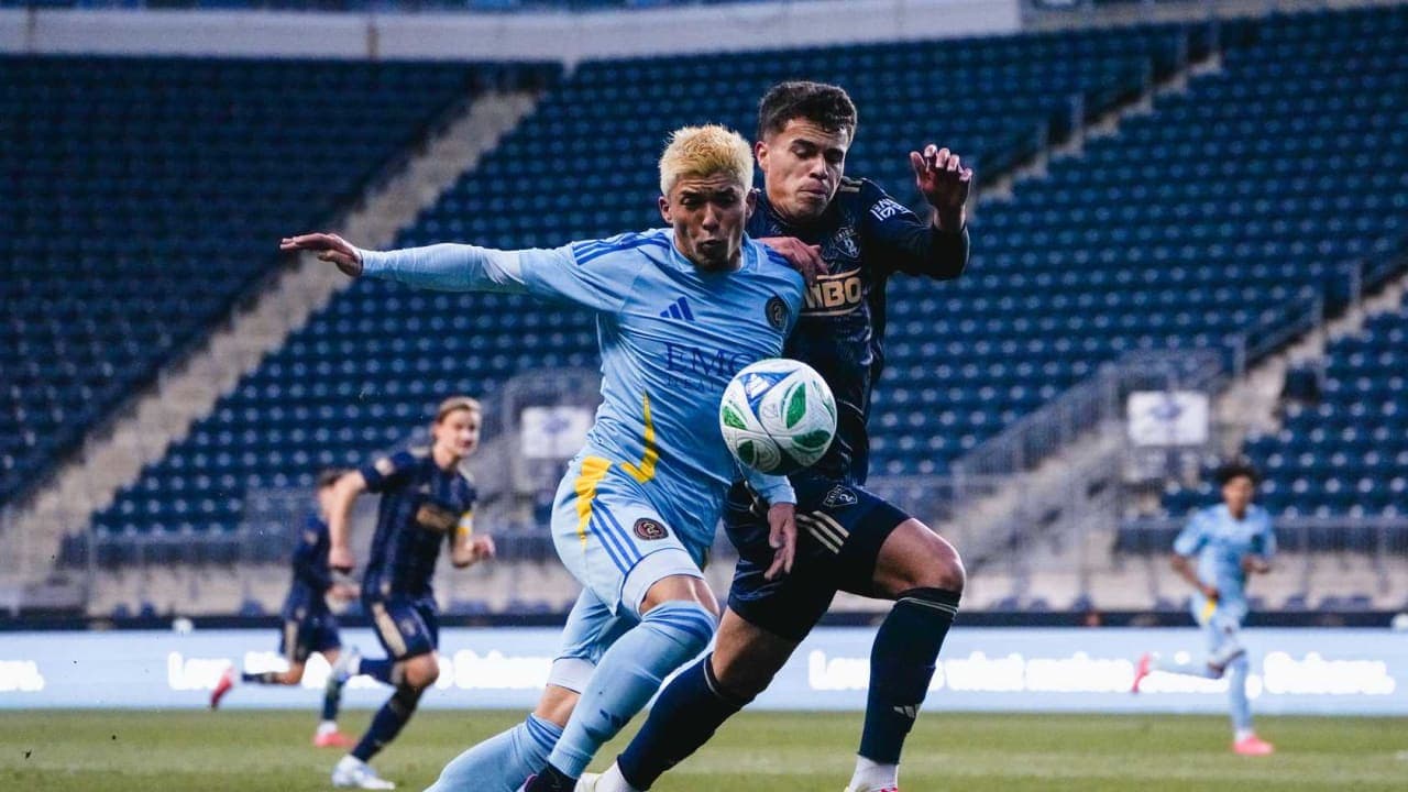 Players competing for the ball in MLS Next Pro