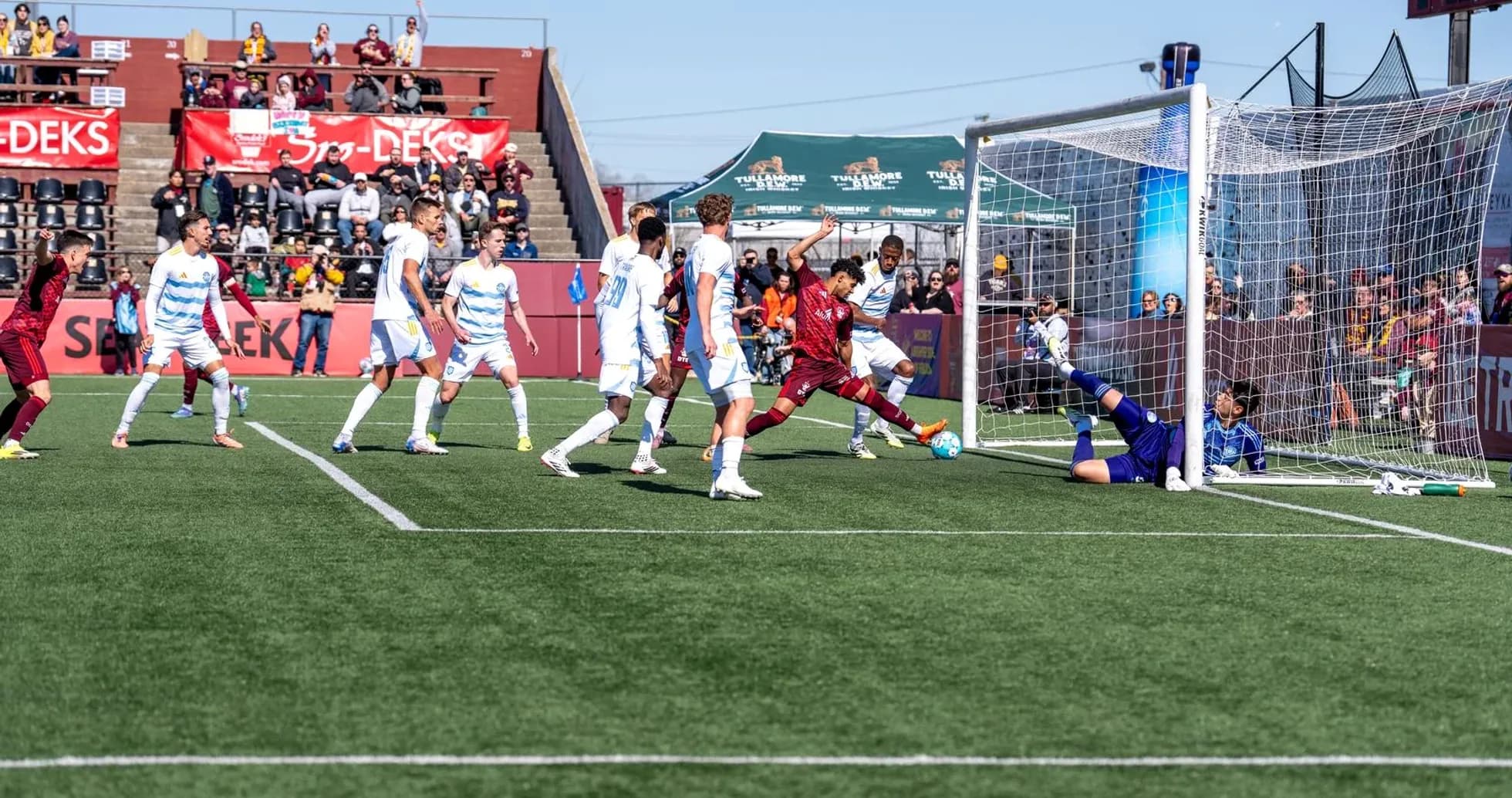 Player attempting to score against Detroit City